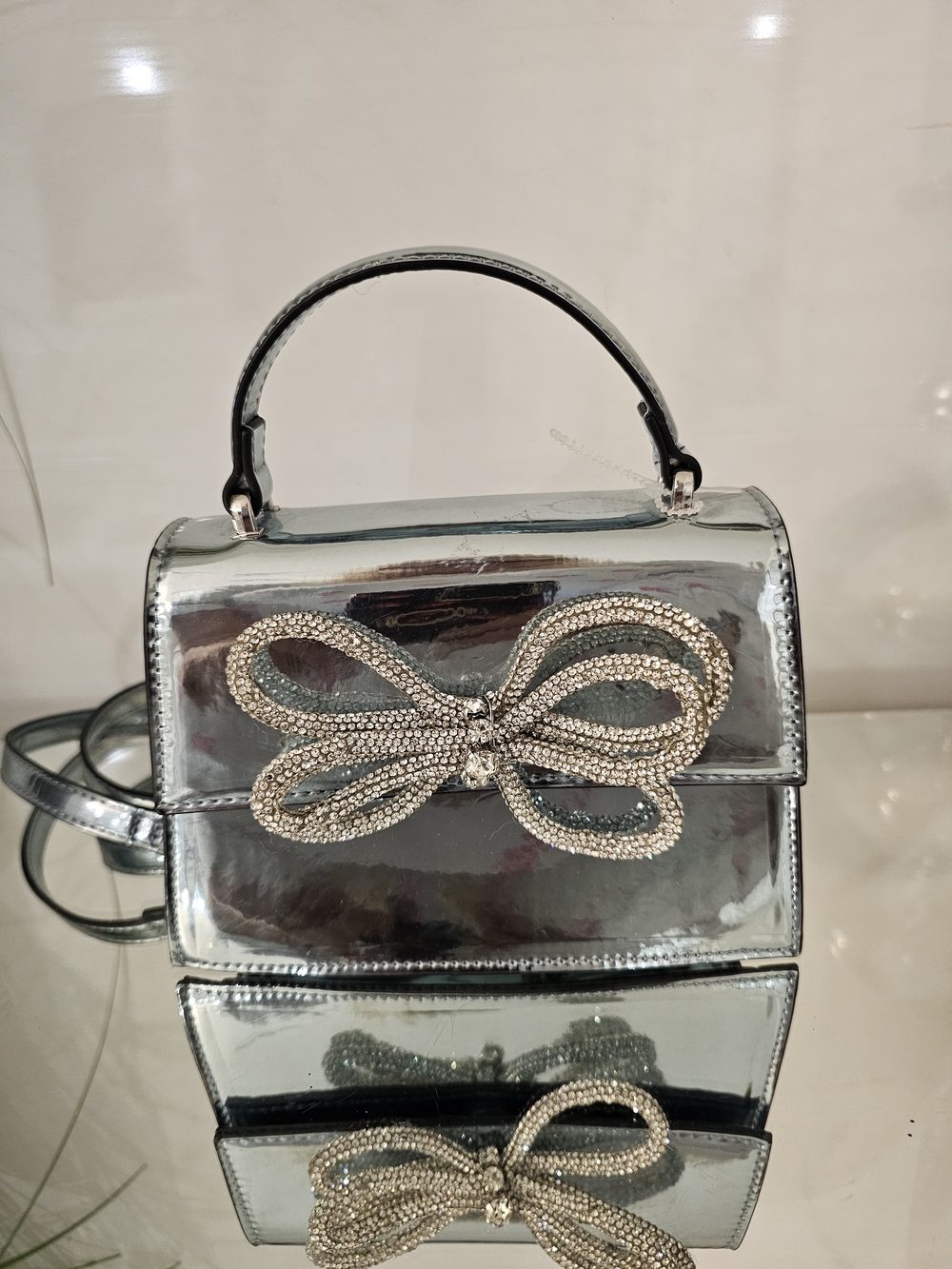 Aldo Metallic Silver Mini Top-Handle Bag with Crystal Bow